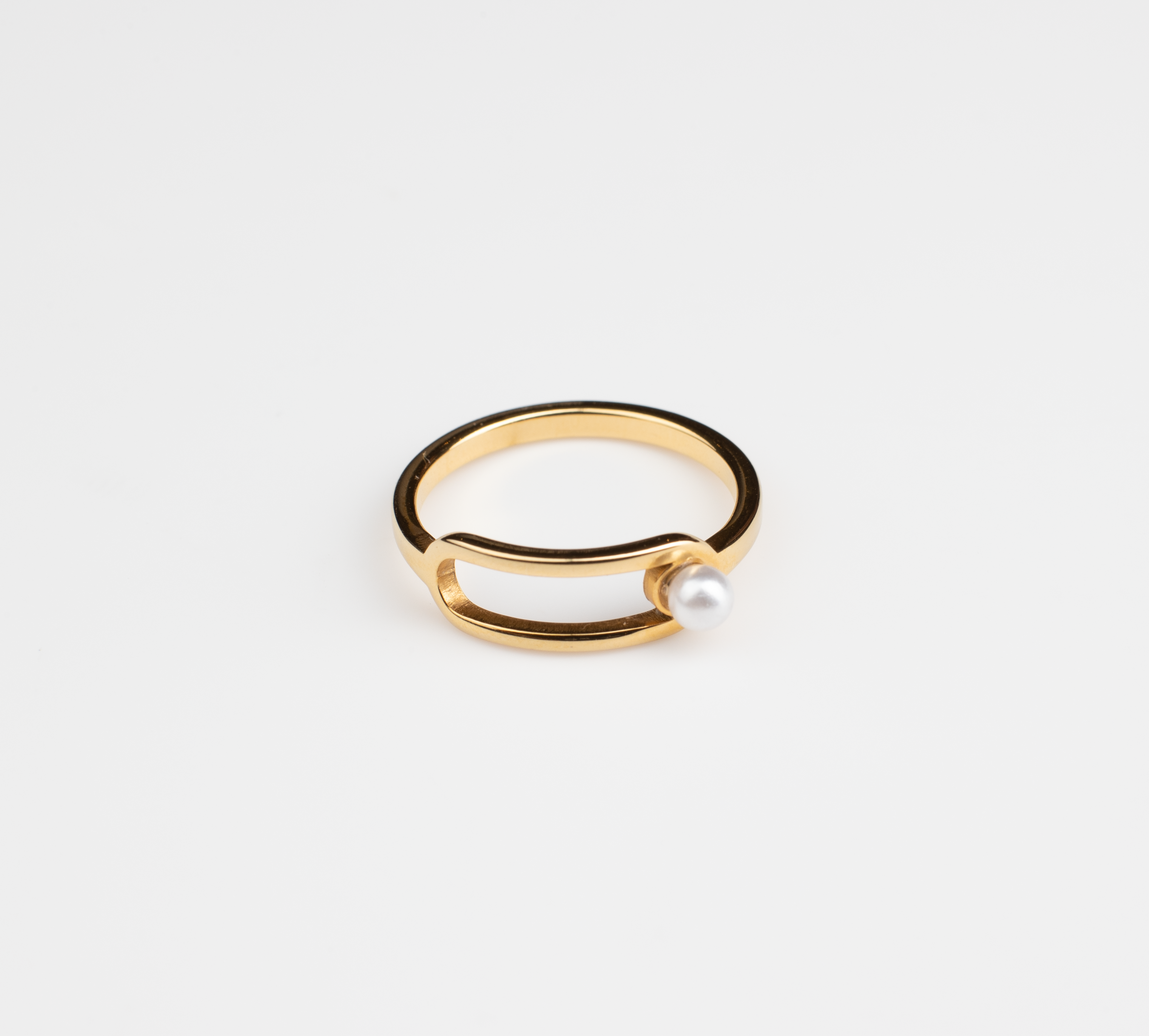 Golden Ring with White Pearl Accent: Modern Hollow Design for Everyday