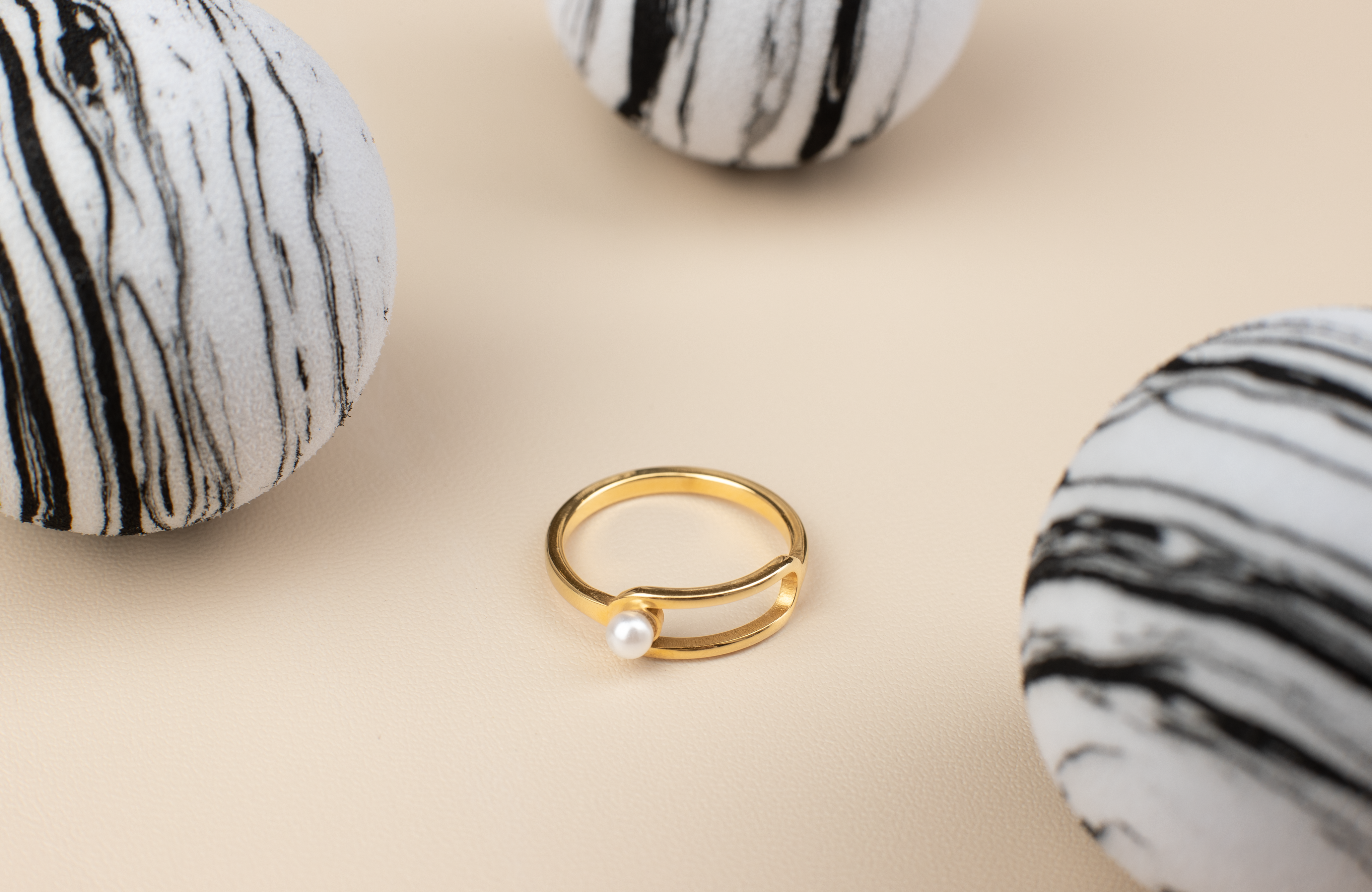 Golden Ring with White Pearl Accent: Modern Hollow Design for Everyday