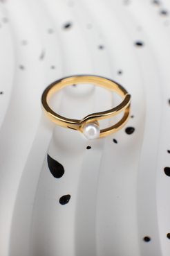 Golden Ring with White Pearl Accent: Modern Hollow Design for Everyday