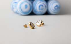 Discover elegance with our charming heart-shaped pearl stud earrings. Crafted with simplicity and adorned with white pearls, these petite studs are perfect for young ladies. Made with titanium steel plated in 18K gold, they effortlessly complement any occasion and make for a versatile and delightful gift.