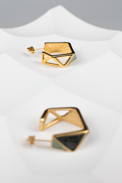 Embrace the avant-garde with our geometrically inspired earrings. Featuring multi-faceted designs, intricate hollow patterns, and vibrant green hues accented by golden borders, these earrings exude elegance and modernity. Plus, with the option for ear clips, they're versatile for any occasion. Crafted with titanium steel plated in 18K gold, they make a perfect gift.