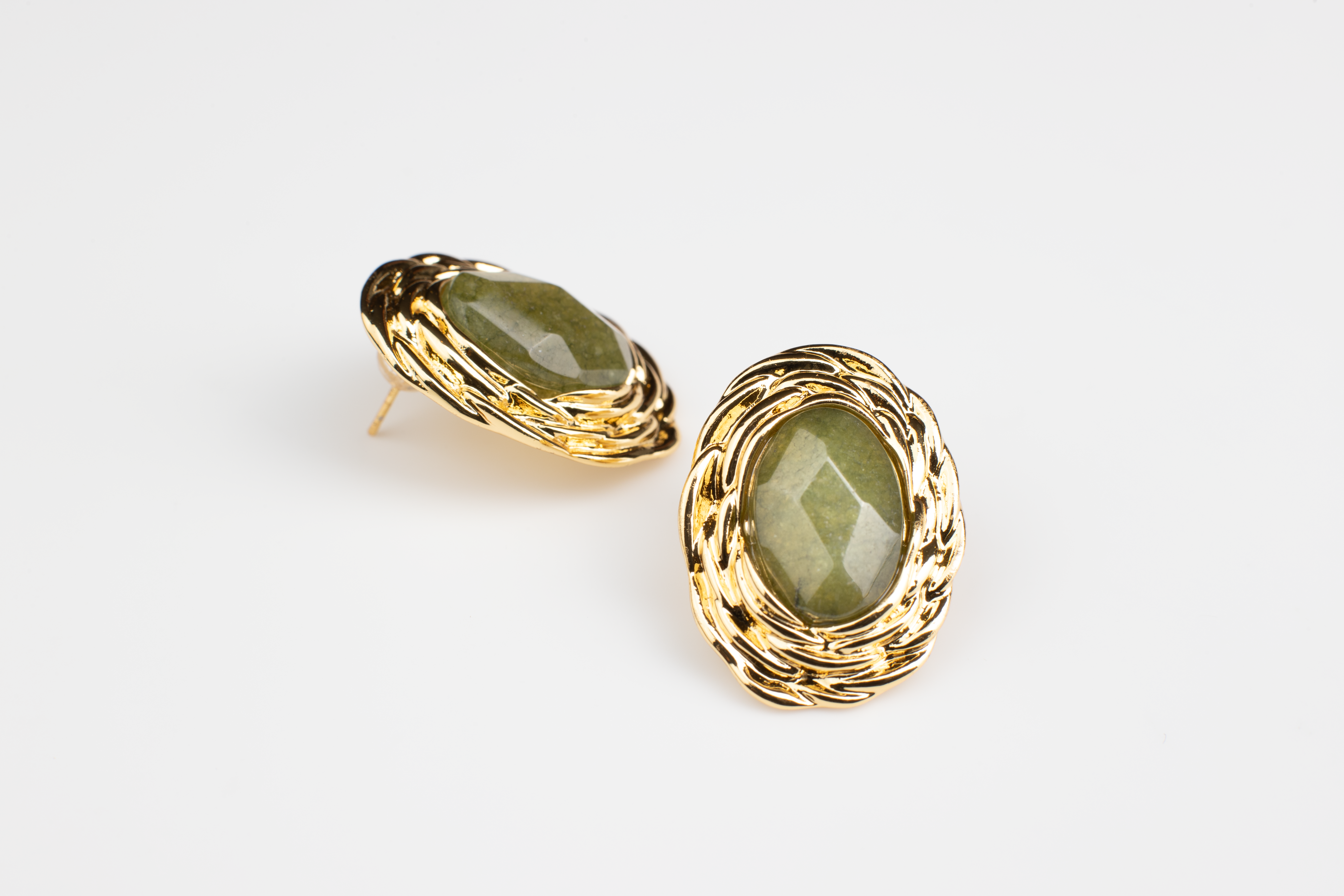 Adorn your ears with timeless elegance. These classic oval-shaped earrings feature lustrous green gemstones delicately set in gold borders, perfect for women seeking refinement and luxury. Crafted from titanium steel plated with 18K gold, they exude sophistication and make a perfect gift for various occasions.