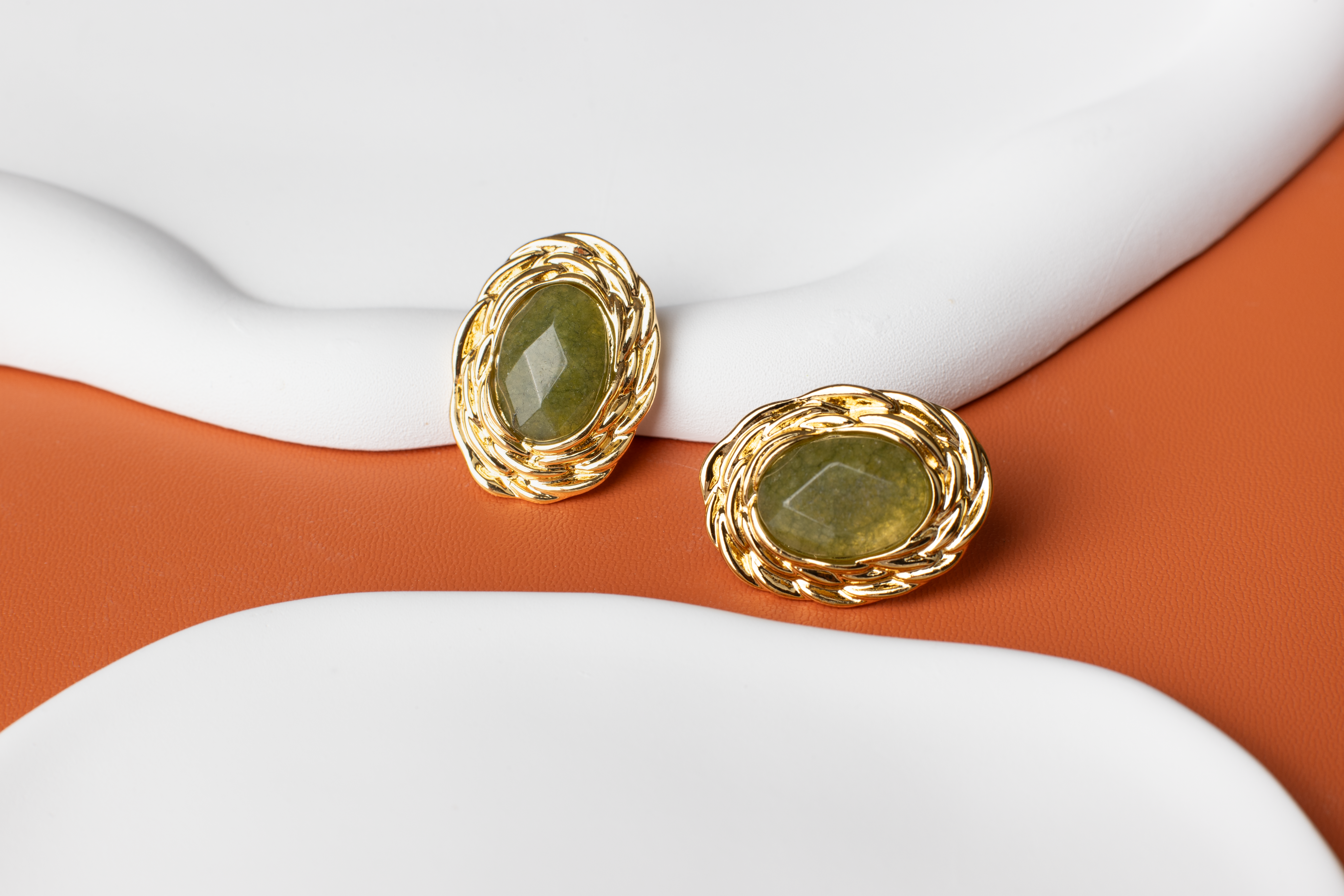 Adorn your ears with timeless elegance. These classic oval-shaped earrings feature lustrous green gemstones delicately set in gold borders, perfect for women seeking refinement and luxury. Crafted from titanium steel plated with 18K gold, they exude sophistication and make a perfect gift for various occasions.