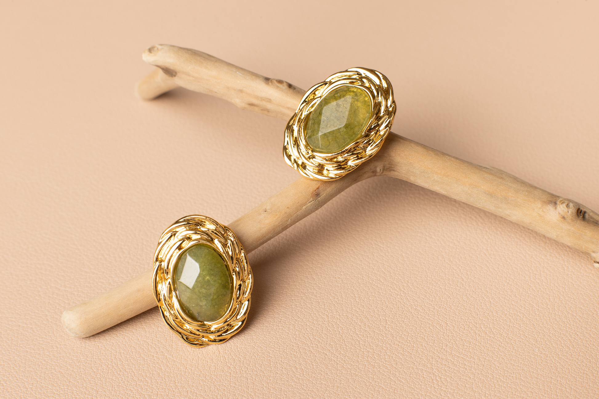 Adorn your ears with timeless elegance. These classic oval-shaped earrings feature lustrous green gemstones delicately set in gold borders, perfect for women seeking refinement and luxury. Crafted from titanium steel plated with 18K gold, they exude sophistication and make a perfect gift for various occasions.